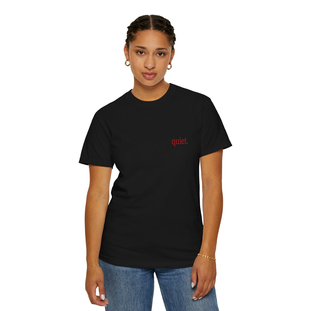 Person wearing a Black t-shirt with a red quiet text on a white background