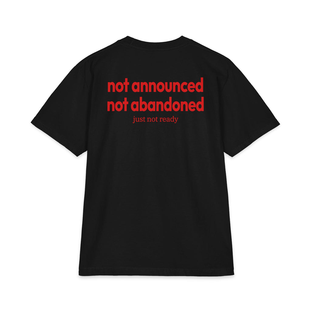 Black t-shirt with red text on the back against a white background